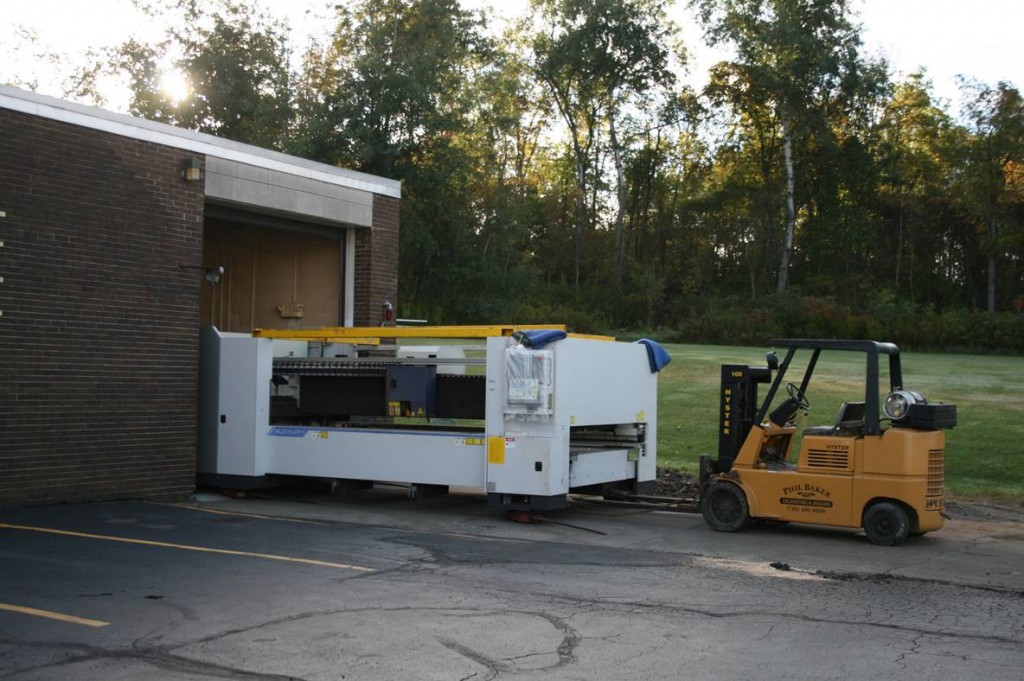 Ulrich removes 5 year old Mitsubishi laser to make room for new laser technology.