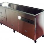 Custom sheet metal capability highlighted with a large stainless steel ultrasonic cleaning tank.
