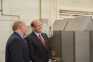 Congressman Tom Reed sees the press brake that performs the initial forming for Ulrich custom sheet metal products and filing cabinets